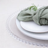 Made from moulded glass these plates feature on their outer edge lovely small glass beads. 