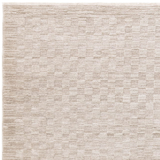 Laurent textured rug in beige, fringe detail