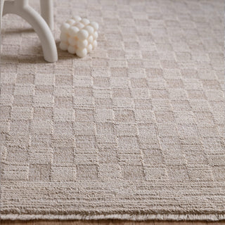 Close-up of the densely woven texture on the Laurent rug in beige