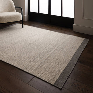 Lima handwoven wool rug in grey styled in a living room