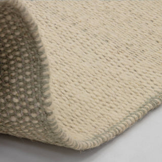 Lima rug in sage, corner detail of the handwoven finish