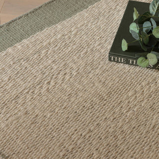 Close-up of the hand-spun wool texture on the Lima rug in sage
