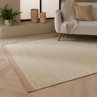 Lima handwoven wool rug in sand styled in a living room
