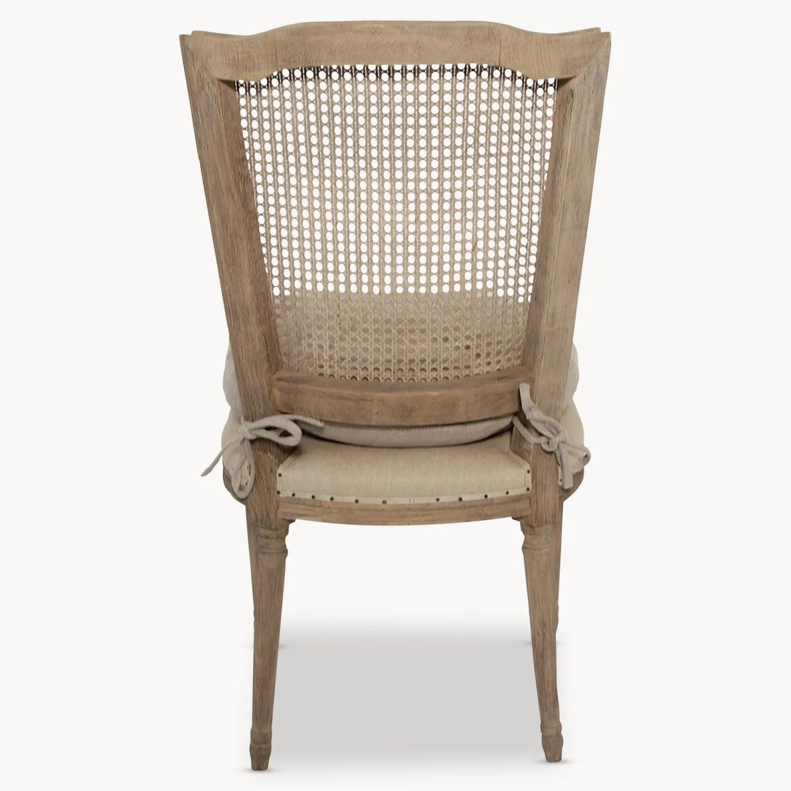 A gorgeous bergère-backed dining chair with an upholstered seat