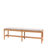 Full view of modern acacia wood bench with grey boucle cushion on white background