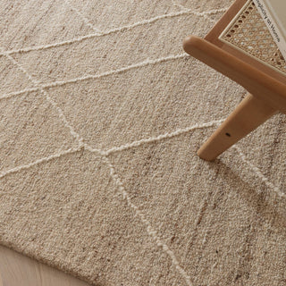 Close-up of the soft hazy lines on the Noah wool rug in natural