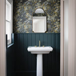 A beautiful frameless arched mirror.