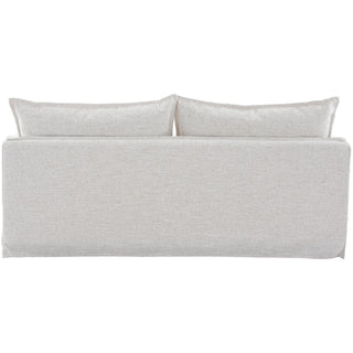 Linen upholstered bed with two pillows on a white background