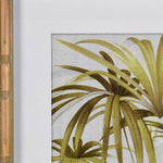 A set of two palm leaf framed wall art pieces complete in a bamboo effect wooden frame.