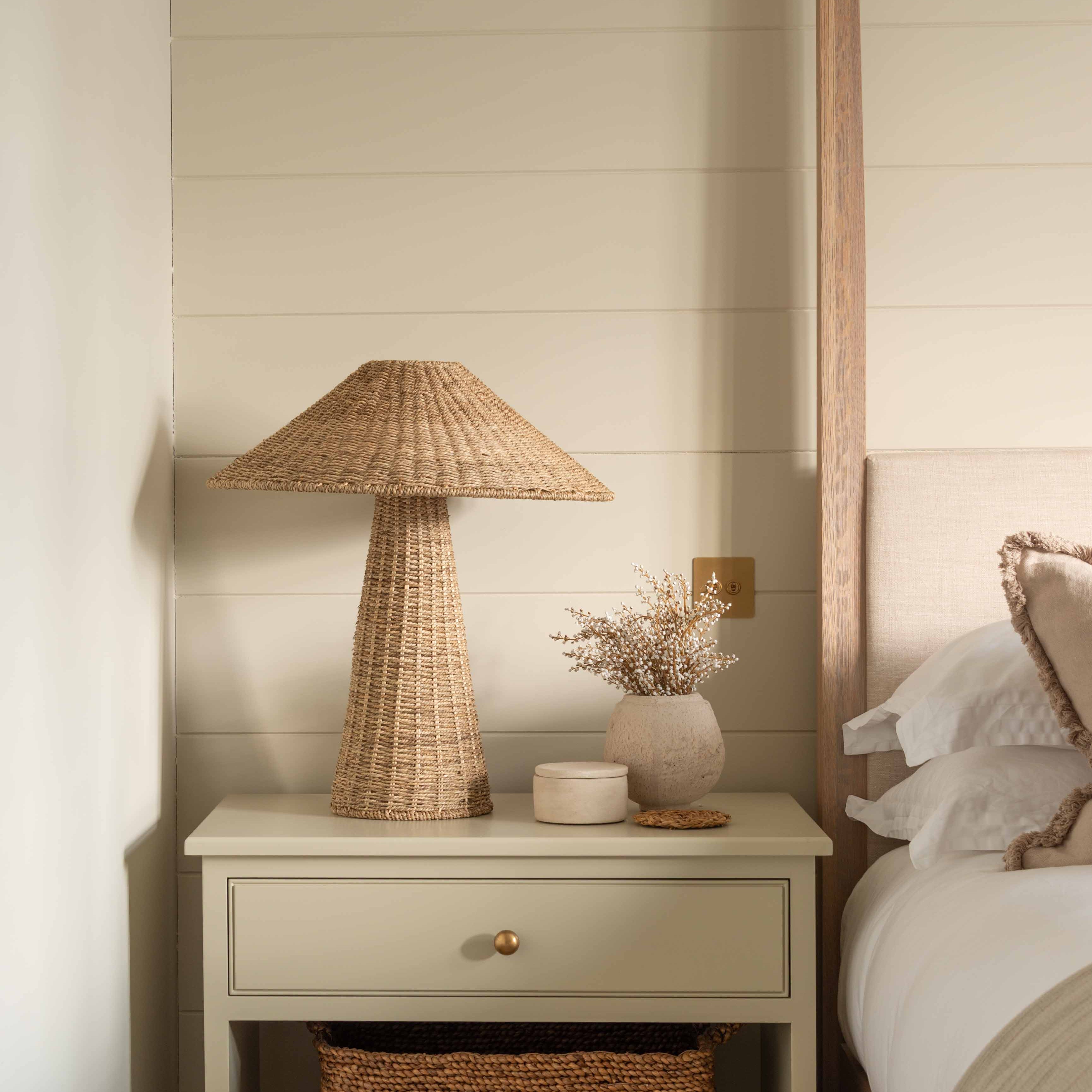 A striking elegant rattan lamp with rattan coolie shade.