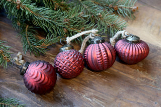 Close detail of a frosted antique red glass bauble