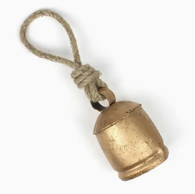 Large festive rustic brass cowbell on rope for holiday farmhouse decor