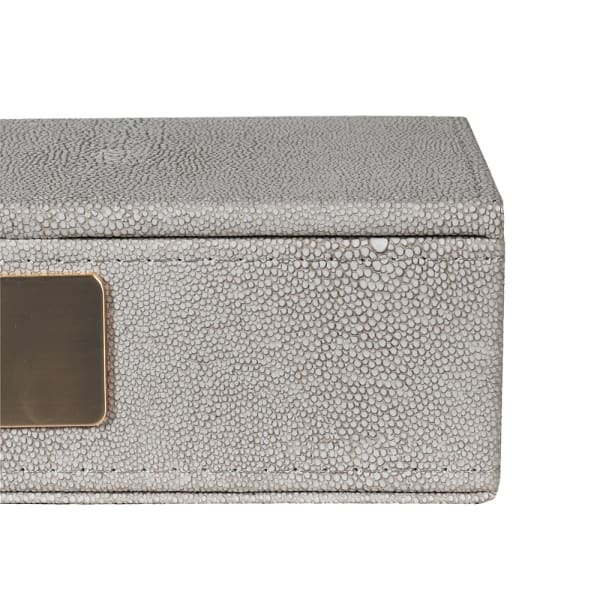 exquisite faux shagreen box with lid and complemented by a plush velvet interior.