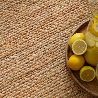 Close-up of the twisted jute weave on the Simplicity rug in natural