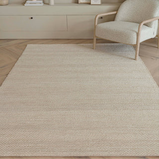 Simplicity handwoven jute rug in blonde styled in a living room