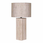 close-up of travertine lamp base and textured linen shade