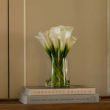 white faux cala lily arrangement in glass vase