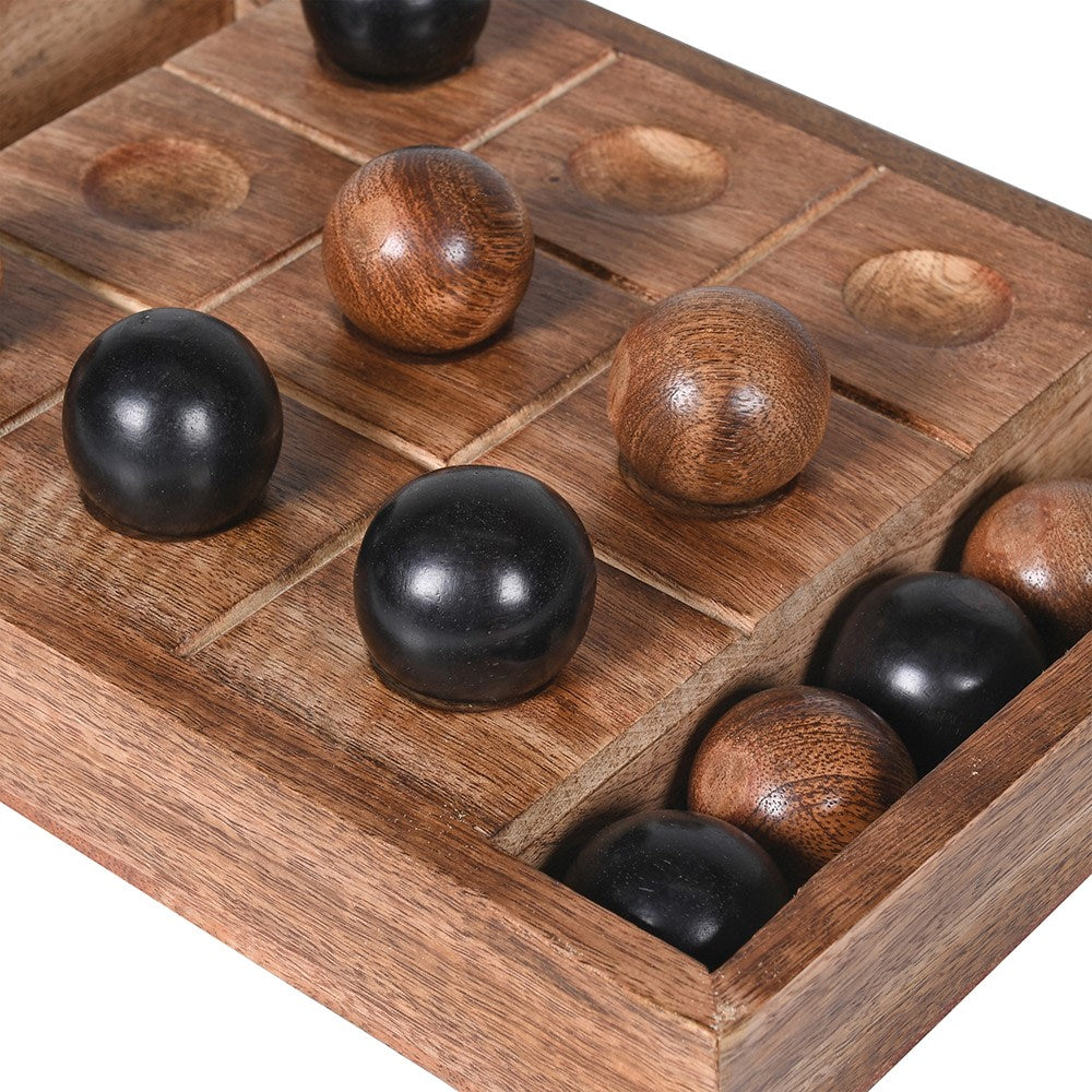 Handcrafted wooden tic tac toe game with solid wood board and wooden ball pieces displayed on a tabletop
