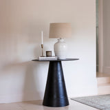 This luxuriously crafted lamp features a white ceramic base adorned with intricate beading, and accompanied by a natural linen shade.