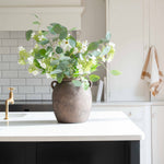 brown stoneware vase with handles