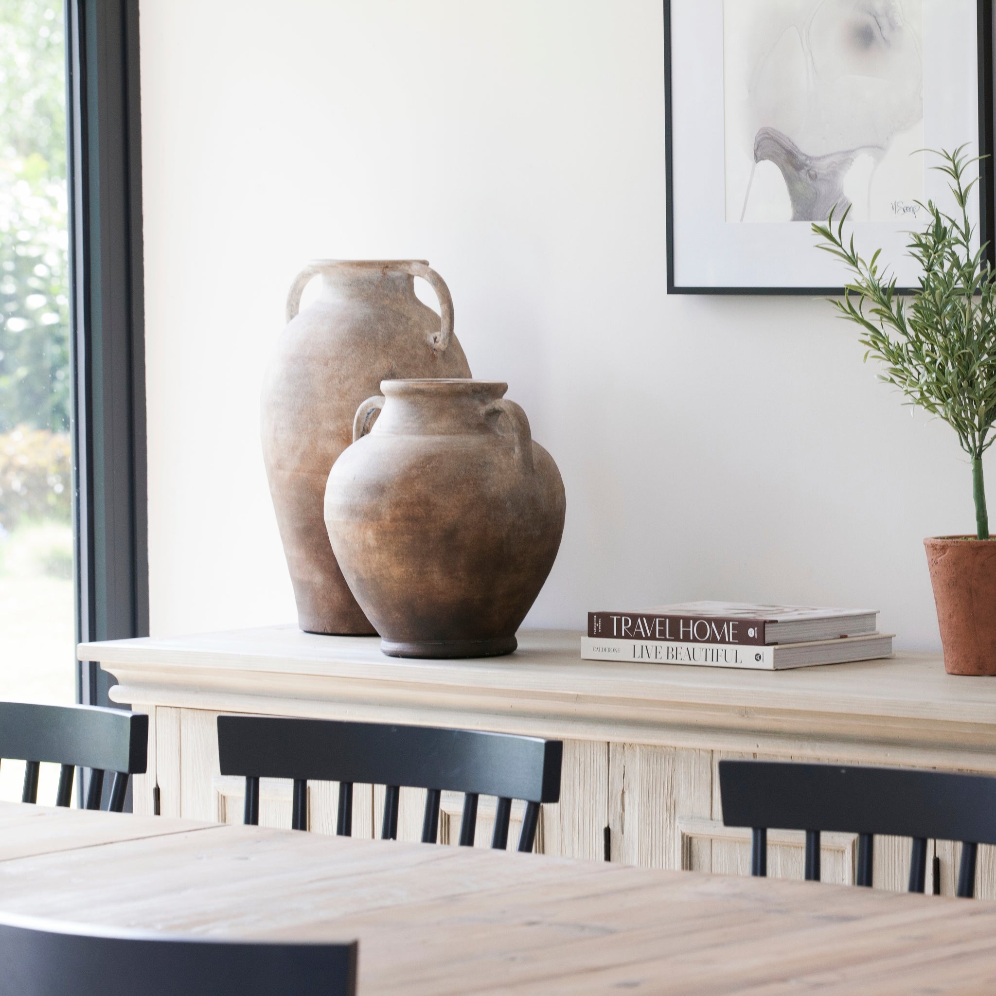 Short terracotta urn styled on console table