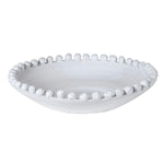 Empty white bobble rim ceramic bowl isolated on a white background
