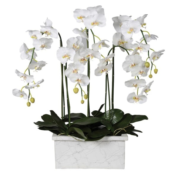 A faux white orchid in a marble planter
