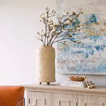 A beautiful stem of magnolia featuring bud detailing and blooming flowers.
