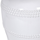 This luxuriously crafted lamp features a white ceramic base adorned with intricate beading, and accompanied by a natural linen shade.