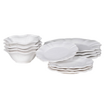 12-piece set of white ceramic scalloped dinner service.