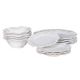 12-piece set of white ceramic scalloped dinner service.