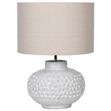 Textured white ceramic table lamp with beige linen drum shade – modern rustic home décor accessory