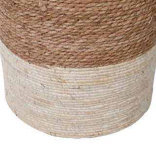 Close-up of a woven basket with two-tone design on a white background