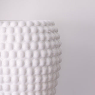 White textured vase on a light gray background