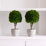 faux topiary in stone pot