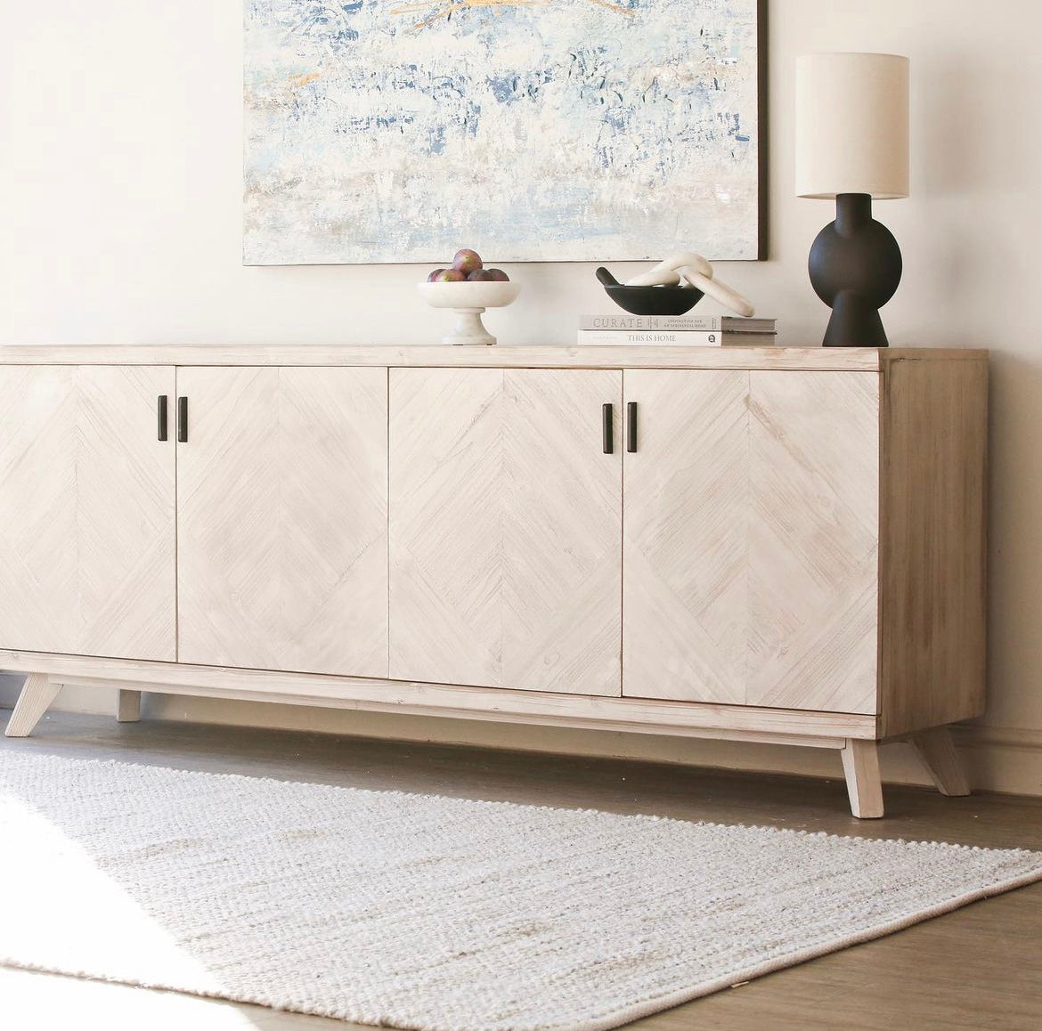 Made from fir, this cabinet has textured doors and metal handles and a beautiful parquet pattern.