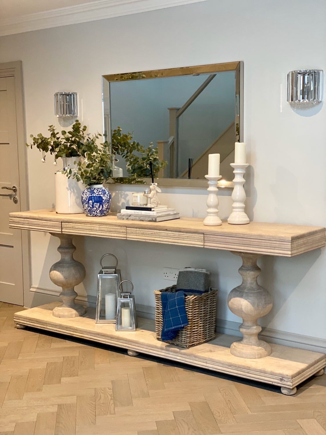 Large acacia wood console table supported by two balustrades