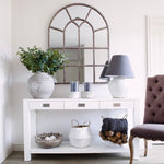 A beautiful Metal Window Mirror in bronze tones.