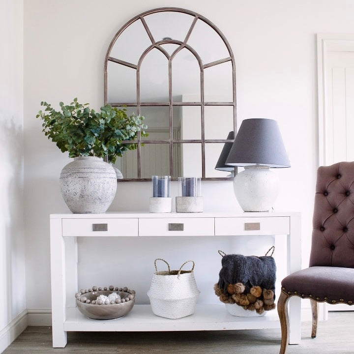 A beautiful Metal Window Mirror in bronze tones.