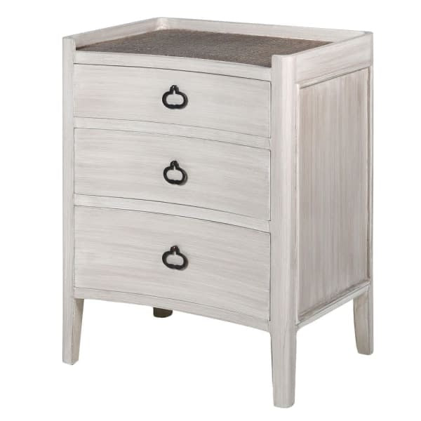 stunning three drawer bedside table in a white wash with a rattan finish.