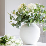 white ceramic flower vase