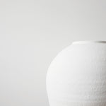 white ceramic flower vase