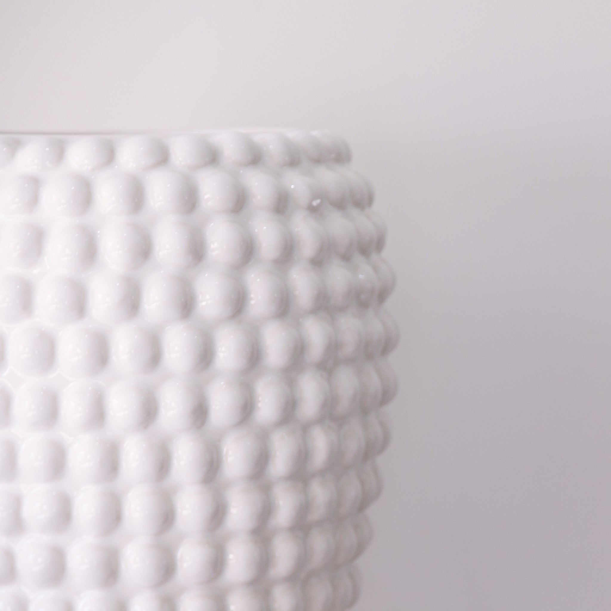 A fabulous White ceramic Vase with Bobble Detail 