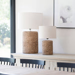 A fabulous Statement Lamp with a chunky rope effect base in natural tones topped with a neutral oatmeal lampshade.